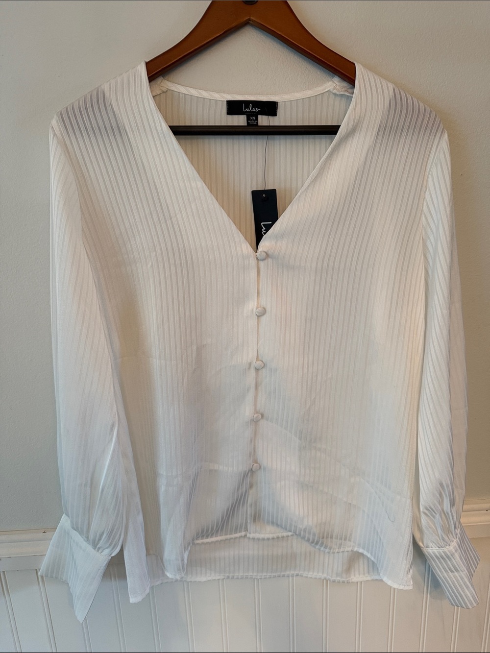 Lulu's Ivory poised affection V-Neck Button-Front Ribbed Blouse